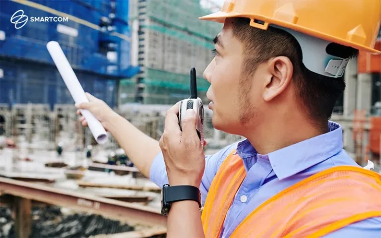 Site supervisors using walkie talkie